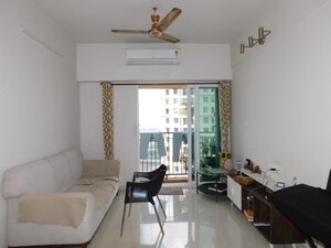 Living Room in 2 BHK Apartment at Rustomjee Urbania Azziano, Thane West – for Sale