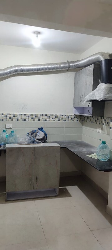 Kitchen in 2 BHK Apartment at Signature Global Orchard Avenue, Sector 93 – for Rent