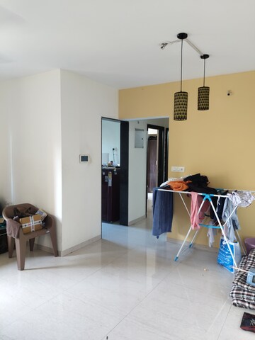 Living Room in 2 BHK Apartment at Nav Highland CHS, Balkum Pada – for Sale