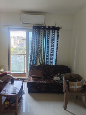 Living Room in 2 BHK Apartment at Nav Highland CHS, Balkum Pada – for Sale