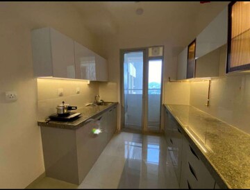 Kitchen in 2 BHK Apartment at Piramal Vaikunth, Balkum Pada – for Rent