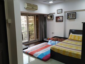 Bedroom in 1 BHK Apartment at Ahuja Sea Crown, Kandivali West – for Rent