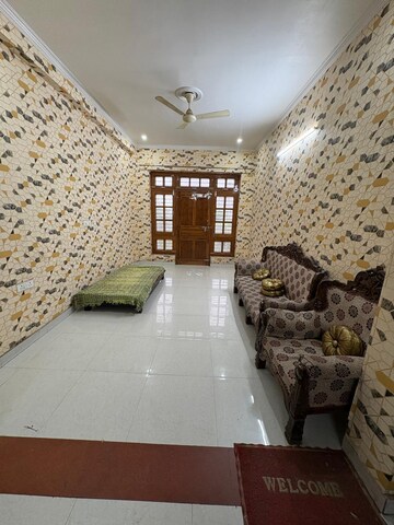 Living Room in 3 BHK Builder Floor at Ansal API Palm Floors, Sushant Golf City – for Rent