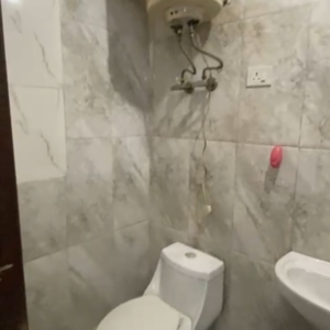 Bathroom in 1.5 BHK Builder Floor at Malviya Nagar – for Rent