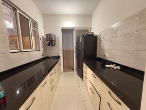 Kitchen in 1 BHK Apartment at Anand Eastwoods, Viman Nagar – for Rent