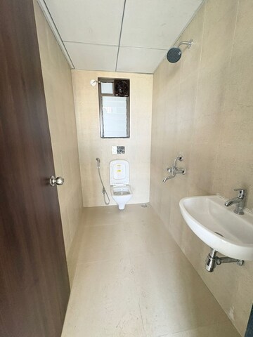 Bathroom in 1 BHK Apartment at Runwal Gardens, Dombivli East – for Rent