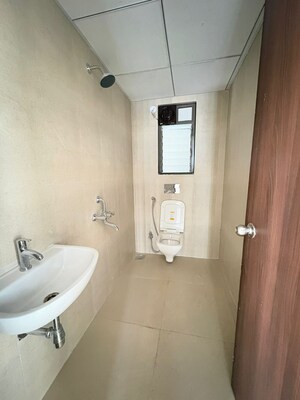Bathroom in 1 BHK Apartment at Runwal Gardens, Dombivli East – for Rent