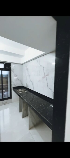 Kitchen in 1 BHK Apartment at Tharwani Vedant Millenia, Titwala – for Sale