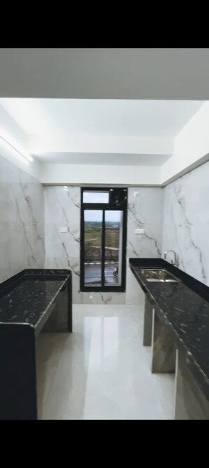 Kitchen in 1 BHK Apartment at Tharwani Vedant Millenia, Titwala – for Sale