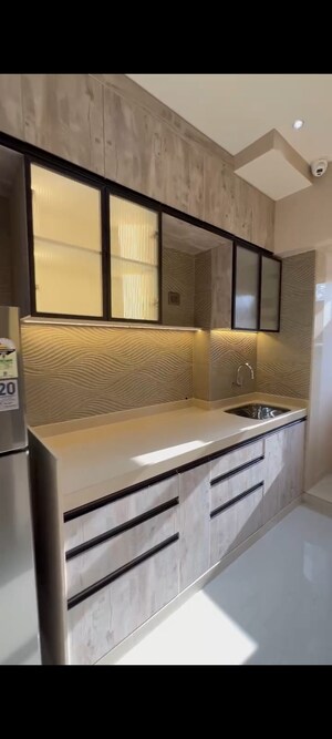 Kitchen in 2 BHK Apartment at Raunak Unnathi Woods Supreme, Ghodbunder Road – for Sale