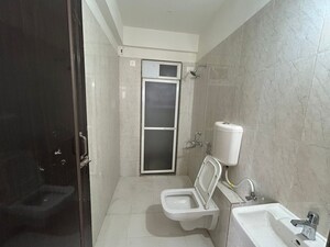 Bathroom in 1 BHK Apartment at Raunak Unnathi Woods Phase 4 And 5, Ghodbunder Road – for Sale