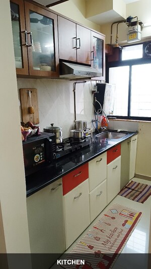 Kitchen in 1 BHK Apartment at Puranik Hometown, Ghodbunder Road – for Sale