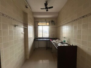 Kitchen in 1 BHK Apartment at Puranik City Phase III, Ghodbunder Road – for Sale