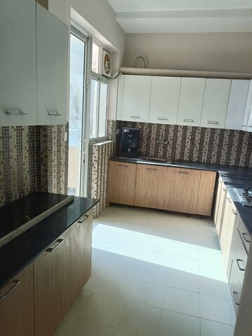 Kitchen in 4 BHK Apartment at Ansal API Versalia, Sector 67a – for Rent