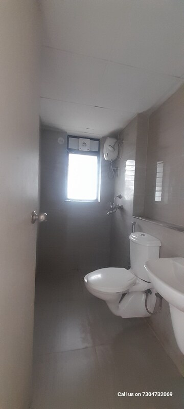 Bathroom in 1 BHK Apartment at Runwal Gardens, Dombivli East – for Rent