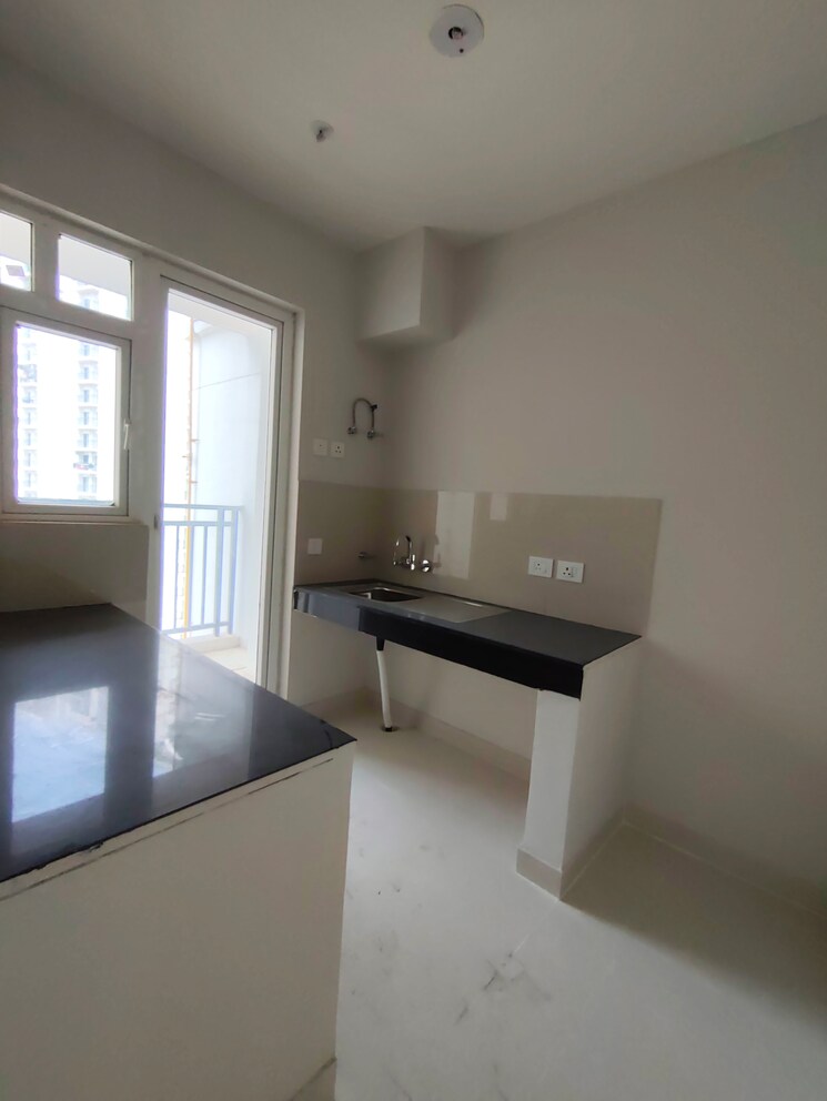 Kitchen, eldeco-live-by-the-greens 2 Bedroom 1137 Sq.Ft. Apartment In Sector 150 Noida 9454365