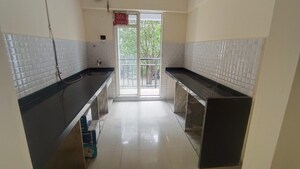 Kitchen in 2 BHK Apartment at Rosa Gardenia, Ghodbunder Road – for Rent