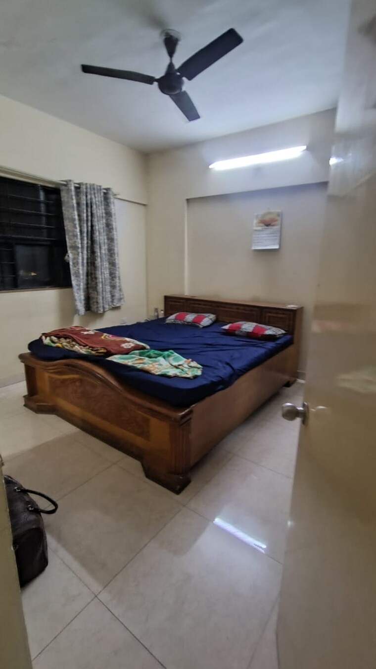 Bedroom, magarpatta-city-cosmos 2 Bedroom 980 Sq.Ft. Apartment In Magarpatta Road Pune 9455234