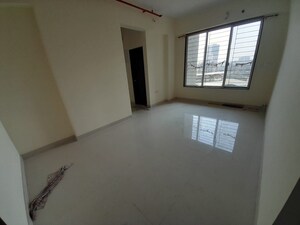 Living Room in 1 BHK Apartment at Yogi Ajmera Bliss, Kalyan West – for Sale