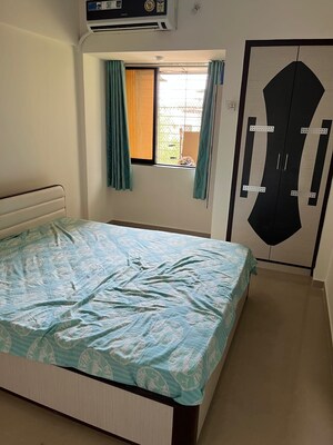 Master Bedroom in 2 BHK Apartment at Blueberry Apartment, Nalasopara West – for Rent
