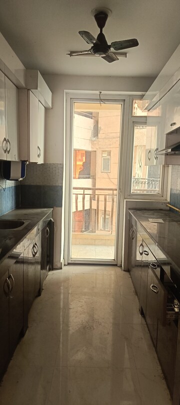 Kitchen in 2 BHK Apartment at Sikka Karmic Greens, Sector 78 – for Rent