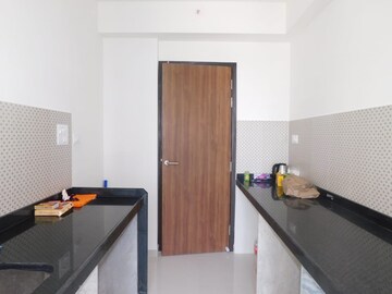 Kitchen in 1 BHK Apartment at Lodha Amara, Kolshet Road – for Sale