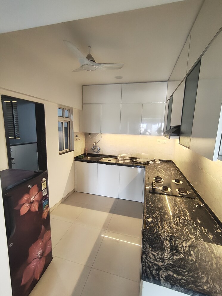 Kitchen, gera-world-of-joy 3 Bedroom 950 Sq.Ft. Apartment In Kharadi Pune 9461645