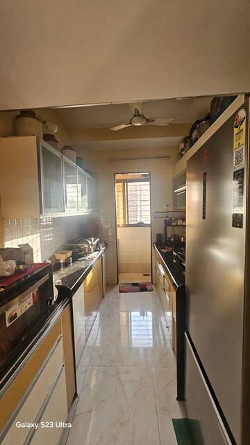 Kitchen in 3 BHK Apartment at Cosmos Jewels, Ghodbunder Road – for Rent