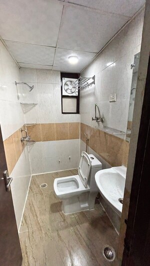Bathroom in 3 BHK Apartment at Nilaya Greens, Raj Nagar Extension – for Rent