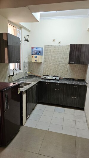 Kitchen in Studio Apartment at Amrapali Princely Estate, Sector 76 – for Rent