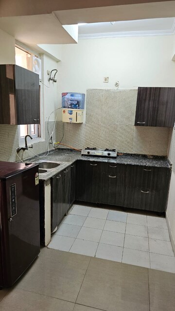 Kitchen in Studio Apartment at Amrapali Princely Estate, Sector 76 – for Rent