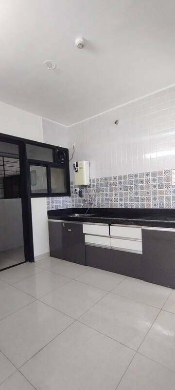 Kitchen in 2 BHK Apartment at Nanded City Pancham, Nanded – for Rent