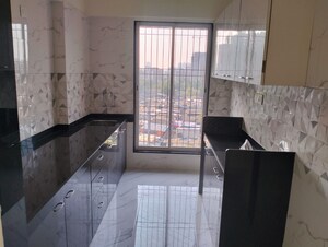 Kitchen in 2 BHK Apartment at Charkop Kesar CHS, Kandivali West – for Rent