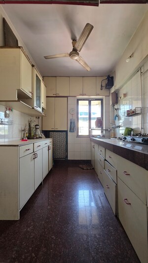 Kitchen in 2 BHK Apartment at Triveni Vasant Vihar CHS, Vasant Vihar – for Sale