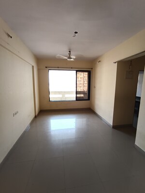 Living Room in 1 BHK Apartment at Ajmera Yogi Dham Phase III, Kalyan West – for Rent