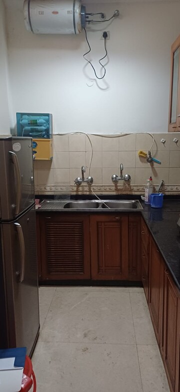 Kitchen in 3 BHK Apartment at Sarvodaya Enclave – for Rent