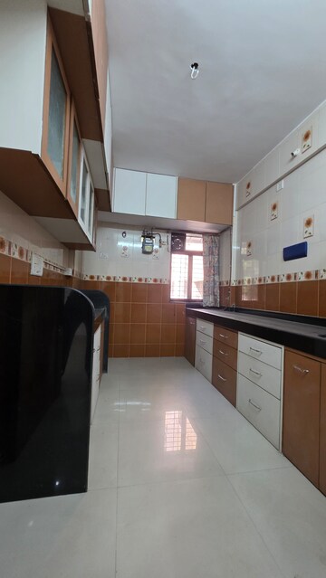 Kitchen in 2 BHK Apartment at Vasant Mandar CHS, Vasant Vihar – for Sale