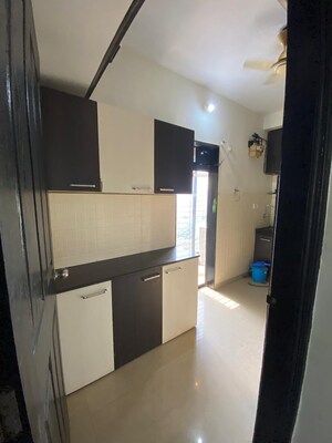 Kitchen in 2 BHK Apartment at Lalani Residency, Kavesar – for Rent