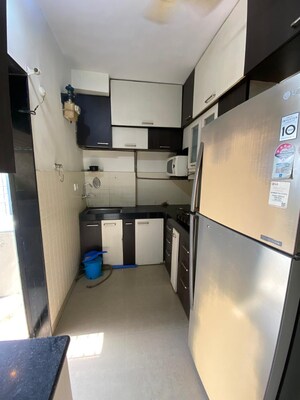 Kitchen in 2 BHK Apartment at Lalani Residency, Kavesar – for Rent