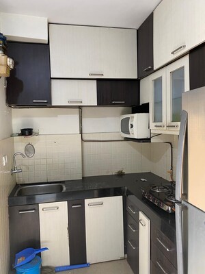 Kitchen in 2 BHK Apartment at Lalani Residency, Kavesar – for Rent