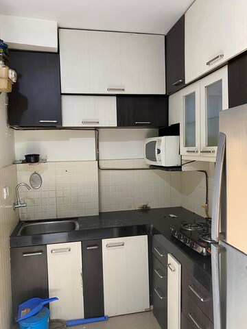 Kitchen in 2 BHK Apartment at Lalani Residency, Kavesar – for Rent