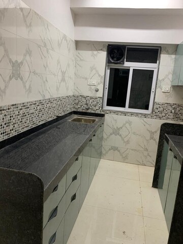 Kitchen in 2 BHK Apartment at DGS Sheetal Tapovan, Malad East – for Rent