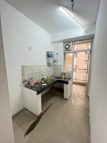 Kitchen in 2 BHK Apartment at Ajnara Homes, Sector 16b Greater Noida – for Rent