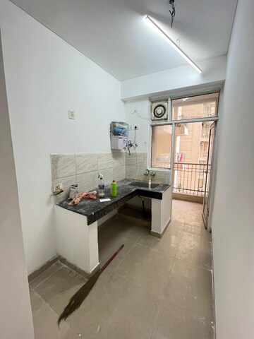 Kitchen in 2 BHK Apartment at Ajnara Homes, Sector 16b Greater Noida – for Rent