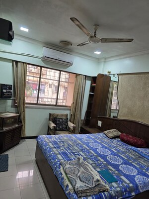 Bedroom in 2 BHK Apartment at Sukratara Apartment, Vile Parle East – for Rent
