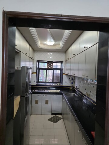 Kitchen in 2 BHK Apartment at Sukratara Apartment, Vile Parle East – for Rent