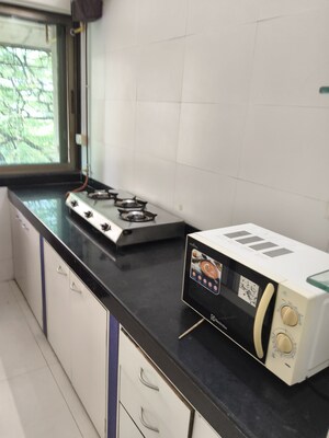 Kitchen in 2 BHK Apartment at Vile Parle West – for Rent
