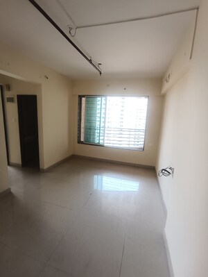 Living Room in 1 BHK Apartment at Ajmera New Era, Kalyan West – for Rent