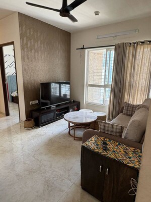 Living Room in 2 BHK Apartment at Lodha Amara, Kolshet Road – for Sale