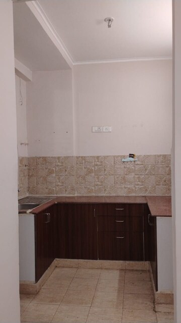 Kitchen in 2 BHK Apartment at Amrapali Golf Homes, Sector 4 Greater Noida – for Rent
